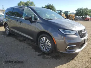 2023 Chrysler Pacifica Hybrid Touring L with VIN 2C4RC1L79PR608659, listed as a Copart auction lot 56945365 with 45,697 mi miles and Salvage title. Bid and sale history available at DreamBid. Image 4.