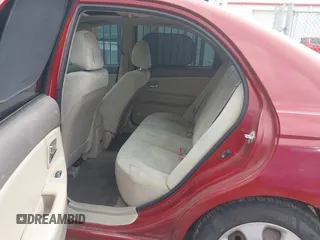 2009 Kia Spectra EX with VIN KNAFE221195606045, listed as a IAAI auction lot 42128548 with 124,577 mi miles. Bid and sale history available at carsss.com. Image 8.