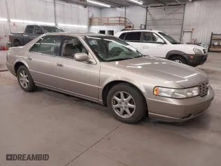 2004 Cadillac Seville Luxury SLS with VIN 1G6KS54Y74U163861, listed as a IAAI auction lot 41881291 with 215,518 mi miles. Bid and sale history available at carsss.com. Image 1.