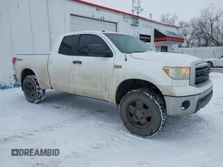 2011 Toyota Tundra with VIN 5TFUY5F12BX183290, listed as a IAAI auction lot 41217291 with 165,418 mi miles and . Bid and sale history available at DreamBid. Image 1.