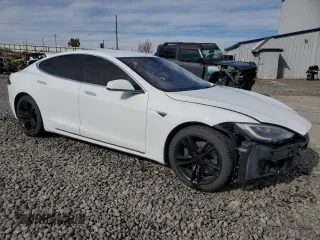 2016 Tesla Model S 90D with VIN 5YJSA1E27GF142380, listed as a Copart auction lot 50661905 with 104,865 mi miles and Salvage Title. Bid and sale history available at DreamBid. Image 4.