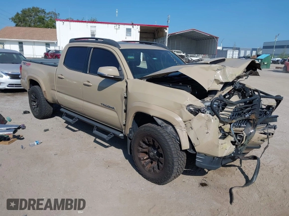 2018 Toyota Tacoma SR5 z VIN 3TMDZ5BN4JM039802, wystawiony jako IAAI lot #42300924 z przebiegiem 48 828 mil mil oraz . Historia ofert i sprzedaży dostępna na DreamBid. Obrazek 1.