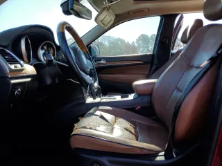 2011 Jeep Grand Cherokee Overland with VIN 1J4RS6GG7BC665979, listed as a Copart auction lot 83394214 with 216,988 mi miles and Salvage Title. Bid and sale history available at DreamBid. Image 7.