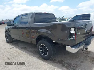 2005 Ford F-150 XLT with VIN 1FTPW12535KF05473, listed as a IAAI auction lot 42140281 with 163,023 mi miles. Bid and sale history available at carsss.com. Image 3.