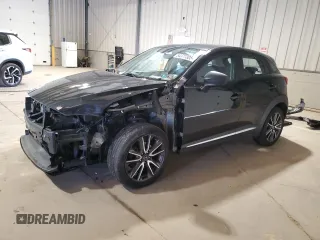 2017 Mazda CX-3 Grand Touring z VIN JM1DKFD71H0141595, wystawiony jako Copart lot #54377305 z przebiegiem 60 907 mil mil oraz Szkody całkowita. Historia ofert i sprzedaży dostępna na DreamBid. Obrazek 1.