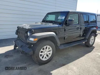 2023 Jeep Wrangler Sport with VIN 1C4HJXDNXPW701795, listed as a Copart auction lot 50451444 with 7,274 mi miles and Salvage Title. Bid and sale history available at DreamBid. Image 1.