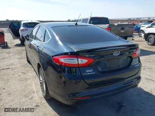 2014 Ford Fusion Titanium Hybrid with VIN 3FA6P0RU9ER111834, listed as a IAAI auction lot 41570337 with 121,099 mi miles. Bid and sale history available at carsss.com. Image 3.