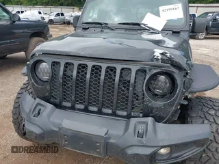 2021 Jeep Gladiator Sport S with VIN 1C6JJTAM7ML554412, listed as a IAAI auction lot 42199167 with 74,263 mi miles and . Bid and sale history available at DreamBid. Image 6.