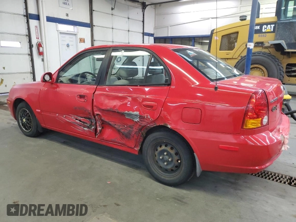2005 Hyundai Accent GLS with VIN KMHCG45C05U661607, listed as a Copart auction lot 71812814 with 238,630 mi miles and Salvage Title. Bid and sale history available at carsss.com. Image 2.