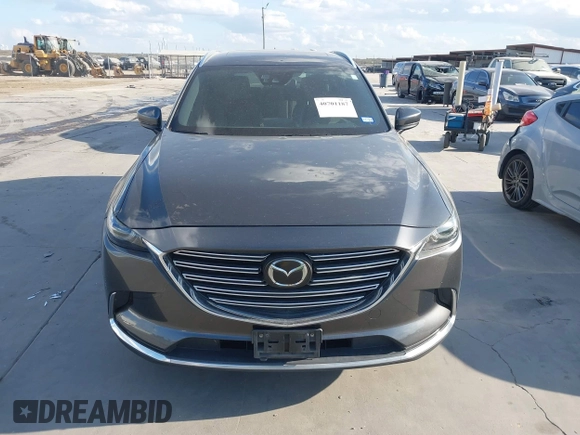 2016 Mazda CX-9 Grand Touring with VIN JM3TCADY8G0114940, listed as a IAAI auction lot 40701187 with 112,311 mi miles and . Bid and sale history available at DreamBid. Image 12.
