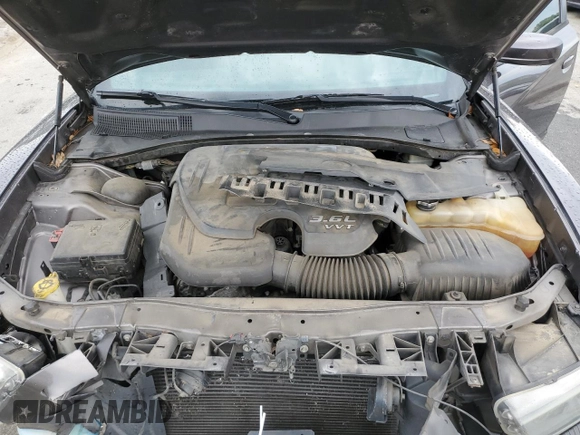 2014 Dodge Charger SXT z VIN 2C3CDXHGXEH261414, wystawiony jako Copart lot #55871705 z przebiegiem 221 000 mil mil oraz Szkoda całkowita • Salvage title. Historia ofert i sprzedaży dostępna na DreamBid. Obrazek 11.