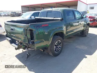 2022 Toyota Tacoma SR with VIN 3TMCZ5AN0NM470396, listed as a IAAI auction lot 41909515 with 35,997 mi miles and . Bid and sale history available at DreamBid. Image 4.