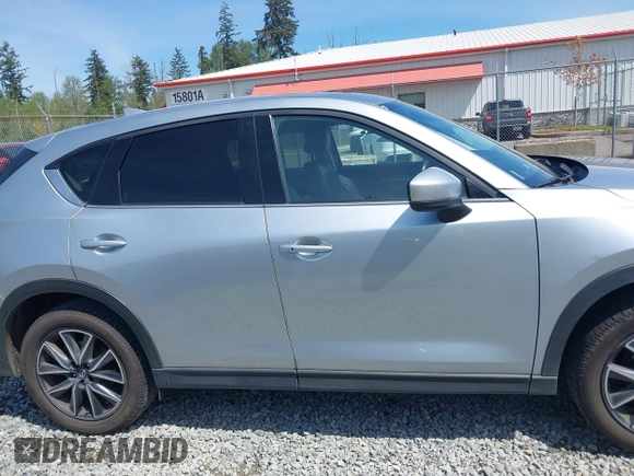 2018 Mazda CX-5 Grand Touring z VIN JM3KFADM7J0318684, wystawiony jako IAAI lot #42226937 z przebiegiem 69 166 mil mil oraz . Historia ofert i sprzedaży dostępna na DreamBid. Obrazek 13.