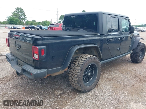 2021 Jeep Gladiator Sport S with VIN 1C6JJTAM7ML554412, listed as a IAAI auction lot 42199167 with 74,263 mi miles and . Bid and sale history available at DreamBid. Image 4.