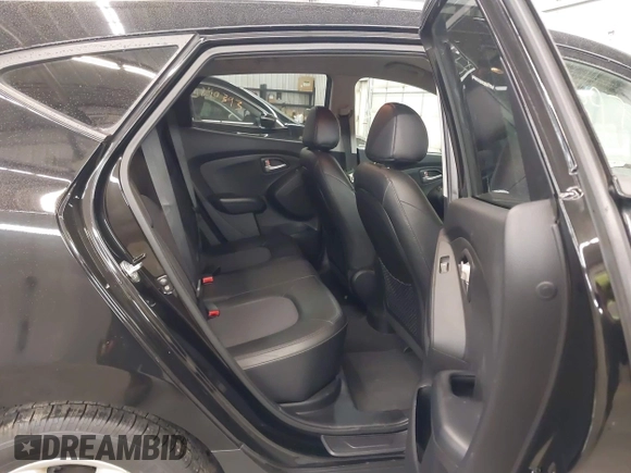 2013 Hyundai Tucson GLS with VIN KM8JU3AC8DU557445, listed as a IAAI auction lot 41839782 with 153,769 mi miles. Bid and sale history available at carsss.com. Image 8.