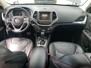 2014 Jeep Cherokee Trailhawk with VIN 1C4PJMBS6EW140981, listed as a Copart auction lot 58260325 with 97,036 mi miles and Salvage title. Bid and sale history available at DreamBid. Image 8.