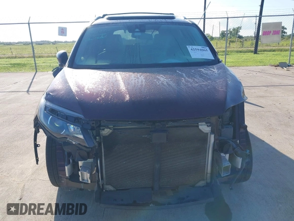 2017 Honda Pilot Touring with VIN 5FNYF5H96HB038413, listed as a IAAI auction lot 42594065 with 130,501 mi miles and . Bid and sale history available at DreamBid. Image 12.