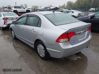 2010 Honda Civic Hybrid with VIN JHMFA3F23AS007725, listed as a IAAI auction lot 42023784 with 230,656 mi miles. Bid and sale history available at carsss.com. Image 3.