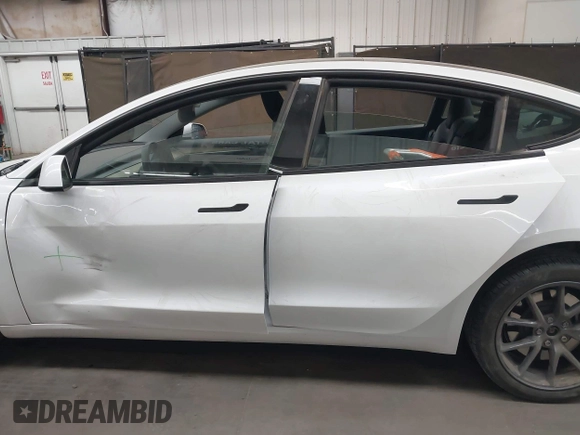 2023 Tesla Model 3 Long Range with VIN 5YJ3E1EB3PF603955, listed as a IAAI auction lot 41915541 with 33,691 mi miles and . Bid and sale history available at DreamBid. Image 14.