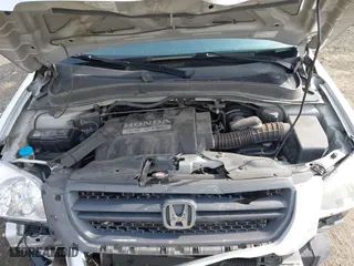 2005 Honda Pilot EX-L with NAVI with VIN 2HKYF18725H534538, listed as a IAAI auction lot 41677322 with 157,987 mi miles. Bid and sale history available at carsss.com. Image 10.