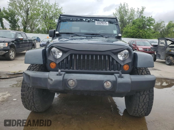 2007 Jeep Wrangler Unlimited Sahara with VIN 1J4GB59177L226122, listed as a Copart auction lot 55529575 with 208,811 mi miles and Salvage title. Bid and sale history available at DreamBid. Image 5.