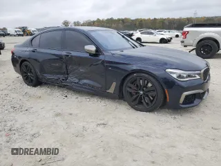 2019 BMW 7 Series M760i xDrive with VIN WBA7H6C51KG615276, listed as a Copart auction lot 79597234 with 39,195 mi miles and Salvage Title. Bid and sale history available at carsss.com. Image 4.