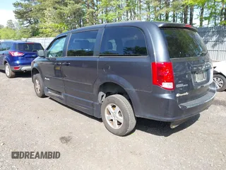 2013 Dodge Grand Caravan SXT with VIN 2C4RDGCG4DR636798, listed as a IAAI auction lot 42240550 with 96,100 mi miles and . Bid and sale history available at DreamBid. Image 3.