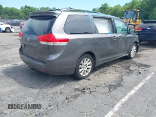2011 Toyota Sienna XLE with VIN 5TDDK3DC8BS028176, listed as a IAAI auction lot 42592654 with 161,992 mi miles and . Bid and sale history available at DreamBid. Image 4.
