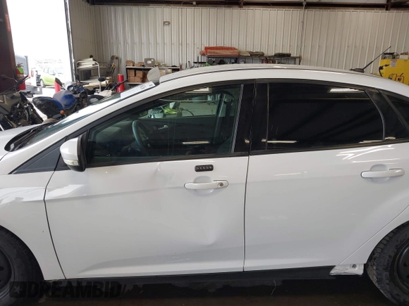 2016 Ford Focus SE with VIN 1FADP3F28GL380663, listed as a IAAI auction lot 42601266 with 78,204 mi miles and . Bid and sale history available at DreamBid. Image 14.
