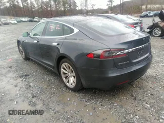 2016 Tesla Model S 70 with VIN 5YJSA1E13GF174542, listed as a IAAI auction lot 41169279 with 72,691 mi miles and . Bid and sale history available at DreamBid. Image 3.