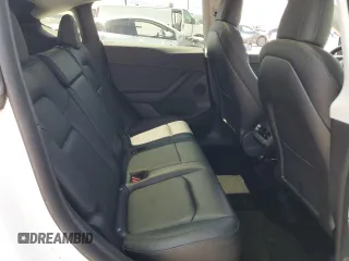 2022 Tesla Model Y Long Range z VIN 7SAYGDEE2NF513823, wystawiony jako Copart lot #51174795 z przebiegiem 28 143 mil mil oraz Szkody całkowita. Historia ofert i sprzedaży dostępna na DreamBid. Obrazek 10.