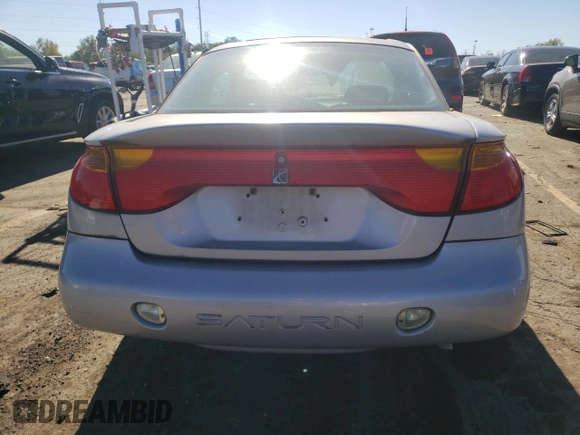 2001 Saturn SC z VIN 1G8ZY14751Z338353, wystawiony jako Copart lot #75086154 z przebiegiem 100 044 mil mil oraz Tytuł czysty. Historia ofert i sprzedaży dostępna na DreamBid. Obrazek 6.