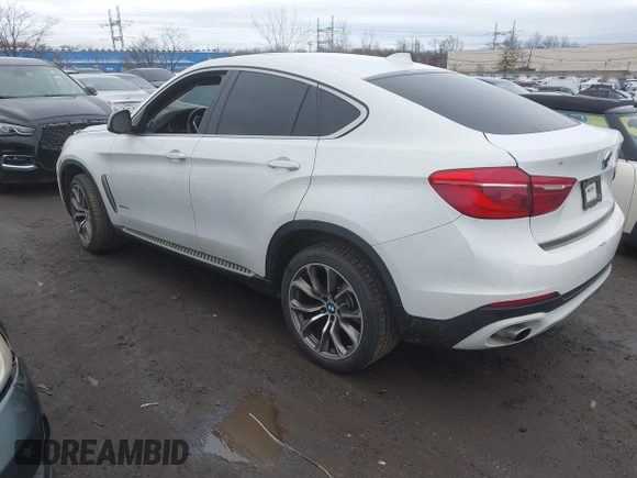 2015 BMW X6 xDrive35i with VIN 5UXKU2C57F0N77194, listed as a IAAI auction lot 41818860 with 105,579 mi miles and . Bid and sale history available at DreamBid. Image 3.