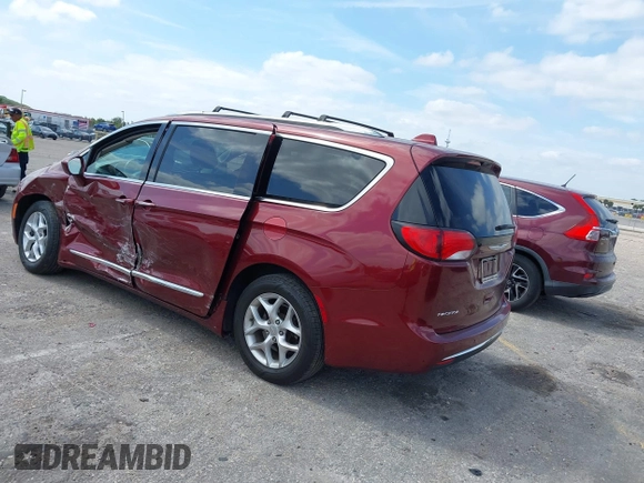 2017 Chrysler Pacifica Touring L with VIN 2C4RC1BG6HR739602, listed as a IAAI auction lot 42085250 with 96,377 mi miles and . Bid and sale history available at DreamBid. Image 3.