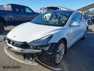 2018 Tesla Model 3 Long Range Battery with VIN 5YJ3E1EA6JF042844, listed as a IAAI auction lot 41349172 with 122,851 mi miles. Bid and sale history available at carsss.com. Image 2.