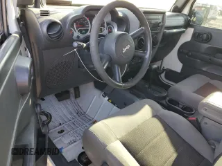 2010 Jeep Wrangler Sport with VIN 1J4AA2D16AL144842, listed as a Copart auction lot 50173535 with 106,000 mi miles and Salvage Title. Bid and sale history available at carsss.com. Image 8.