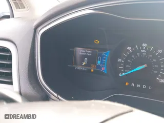 2014 Ford Fusion Titanium Hybrid with VIN 3FA6P0RU0ER329063, listed as a IAAI auction lot 40072913 with 210,274 mi miles. Bid and sale history available at carsss.com. Image 7.