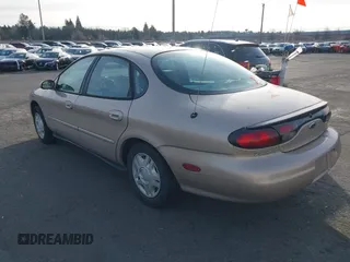 1999 Ford Taurus SE with VIN 1FAFP53U4XG223246, listed as a IAAI auction lot 41570969 with 59,064 mi miles. Bid and sale history available at carsss.com. Image 3.