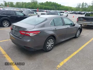 2019 Toyota Camry Hybrid LE z VIN 4T1B31HK4KU511360, wystawiony jako IAAI lot #42298260 z przebiegiem 133 019 mil mil oraz . Historia ofert i sprzedaży dostępna na DreamBid. Obrazek 4.