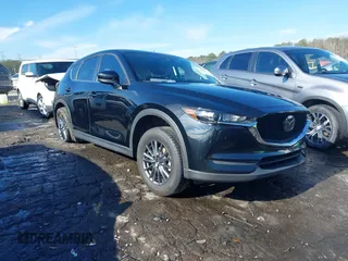 2021 Mazda CX-5 Touring with VIN JM3KFBCM9M0483082, listed as a IAAI auction lot 41305127 with 42,926 mi miles. Bid and sale history available at carsss.com. Image 1.