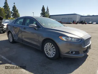 2013 Ford Fusion SE Hybrid z VIN 3FA6P0LU0DR274279, wystawiony jako Copart lot #57462315 z przebiegiem 272 825 mil mil oraz Szkoda całkowita • Salvage title. Historia ofert i sprzedaży dostępna na DreamBid. Obrazek 4.