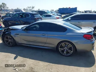 2013 BMW M6 with VIN WBSLX9C51DC968593, listed as a IAAI auction lot 42465979 with 88,010 mi miles and . Bid and sale history available at DreamBid. Image 14.