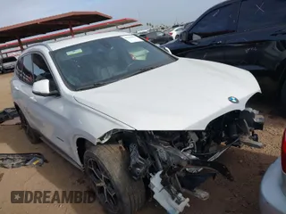 2018 BMW X1 sDrive28i with VIN WBXHU7C32J5H41587, listed as a IAAI auction lot 41538394 with 125,804 mi miles. Bid and sale history available at carsss.com. Image 1.