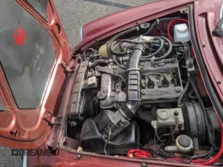 1988 Alfa Romeo Spider z VIN ZARBC5767J1056025, wystawiony jako Copart lot #58116455 z przebiegiem 78 443 mil mil oraz Tytuł czysty. Historia ofert i sprzedaży dostępna na DreamBid. Obrazek 7.