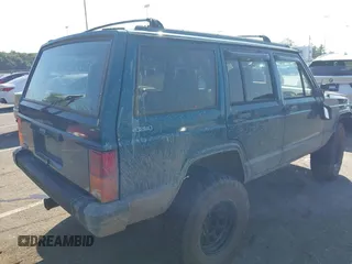 1995 Jeep Cherokee Sport z VIN 1J4FJ68S7SL623451, wystawiony jako IAAI lot #42581407 z przebiegiem 160 581 mil mil oraz . Historia ofert i sprzedaży dostępna na DreamBid. Obrazek 4.