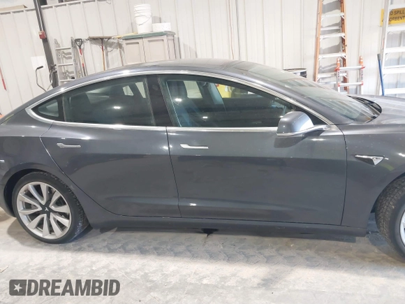 2018 Tesla Model 3 Long Range Battery with VIN 5YJ3E1EB1JF145520, listed as a IAAI auction lot 41360939 with 95,010 mi miles and . Bid and sale history available at DreamBid. Image 13.