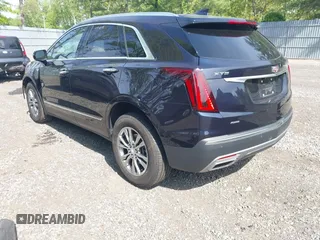 2021 Cadillac XT5 AWD Premium Luxury z VIN 1GYKNDRS8MZ217572, wystawiony jako IAAI lot #42190571 z przebiegiem 25 100 mil mil oraz . Historia ofert i sprzedaży dostępna na DreamBid. Obrazek 3.