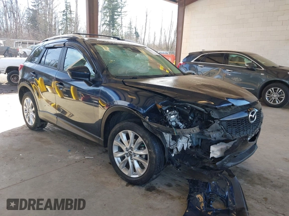 2014 Mazda CX-5 Grand Touring with VIN JM3KE2DY6E0394172, listed as a IAAI auction lot 41698468 with 89,554 mi miles. Bid and sale history available at carsss.com. Image 1.