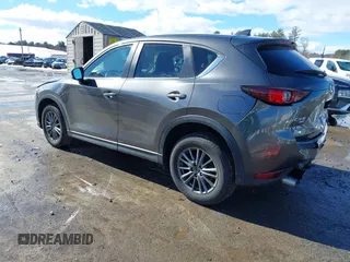 2017 Mazda CX-5 Touring with VIN JM3KFBCL3H0214881, listed as a IAAI auction lot 41694560 with 64,609 mi miles. Bid and sale history available at carsss.com. Image 3.