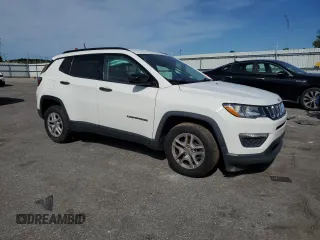 2018 Jeep Compass Sport with VIN 3C4NJCAB7JT140622, listed as a Copart auction lot 58162185 with 128,686 mi miles and Salvage title. Bid and sale history available at DreamBid. Image 4.